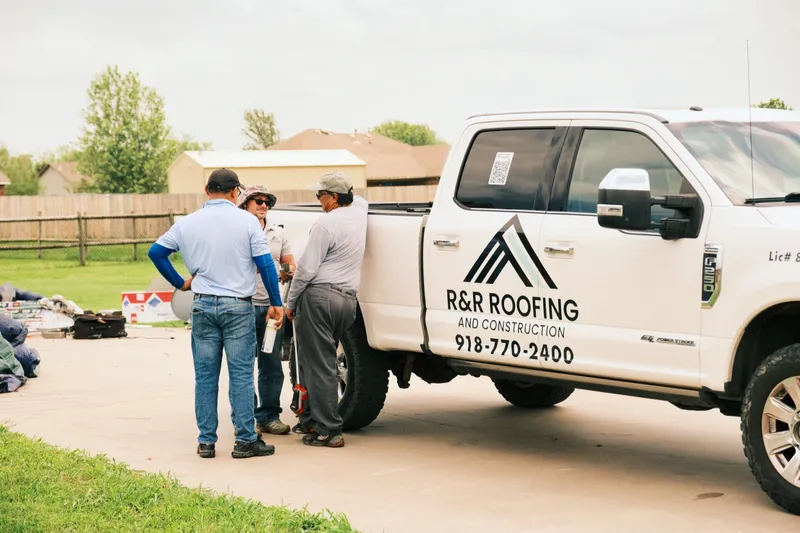 R&R Roofing crew at the truck before starting a roof replacement