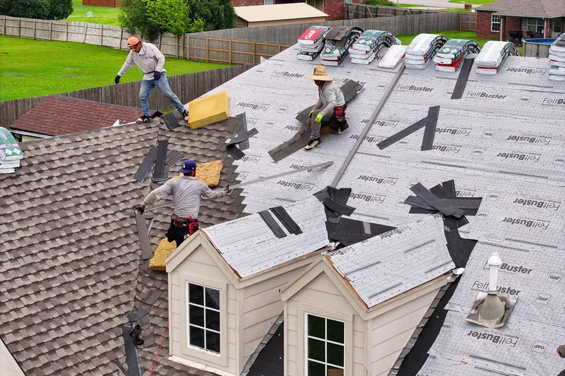 Aerial view of the R&R crew working across a dormered roof