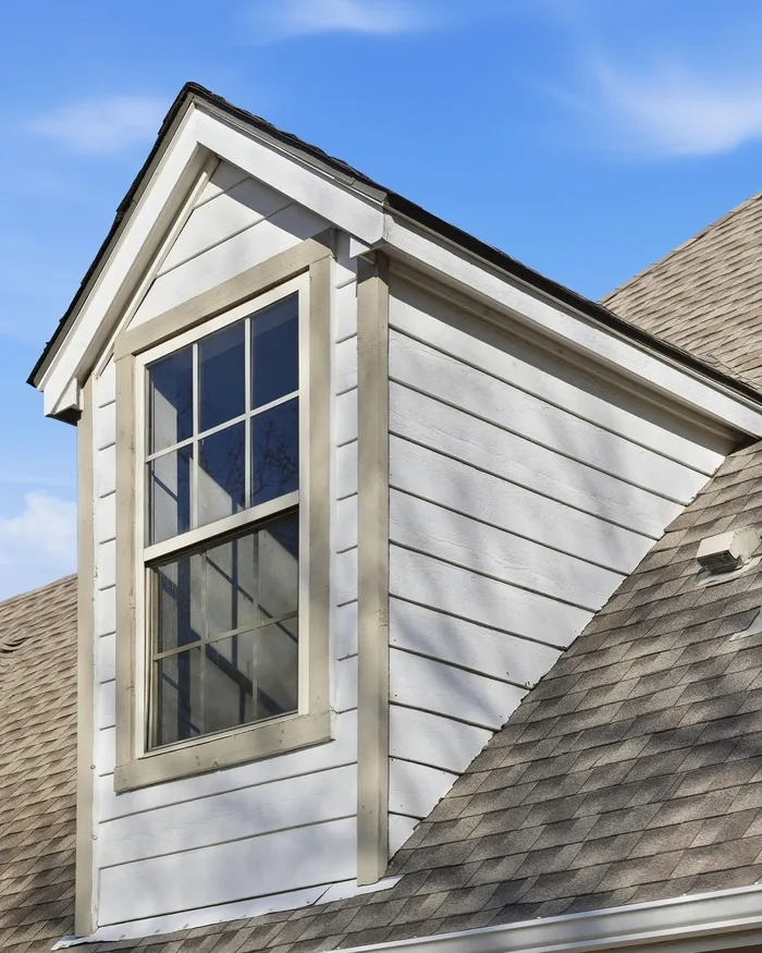 Dormer window and completed shingle roof on a Tulsa area home